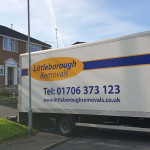 Littleborough Removals van parked at house driveway